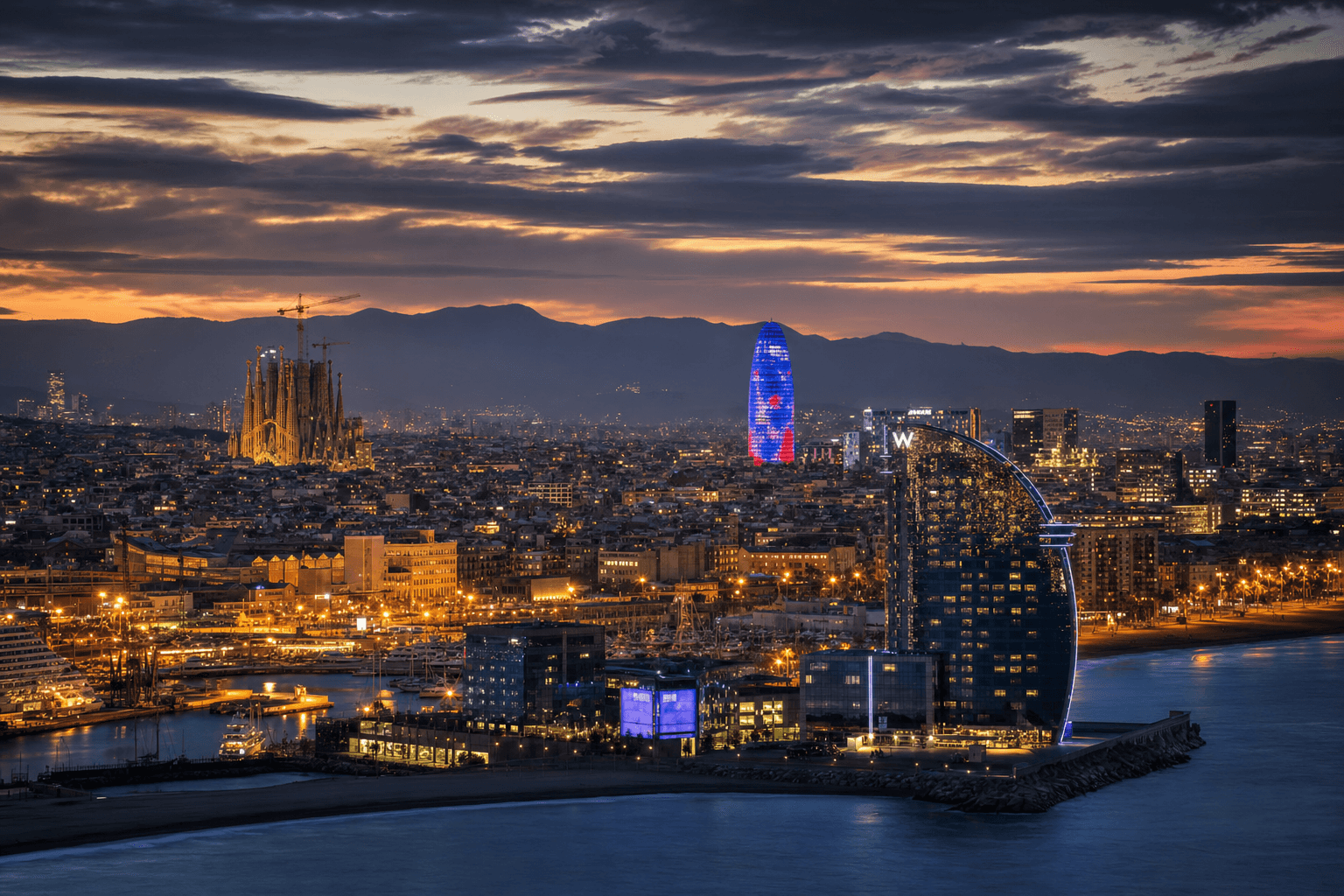 Barcelona skyline at dusk with Sagrada Familia and Mediterranean sea